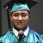 Juan Puac in graduation cap